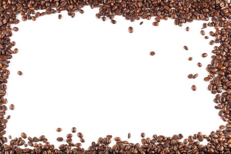 Coffee beans framing the image, on white.の写真素材