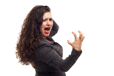 Angry business woman portrait isolated over a white の写真素材