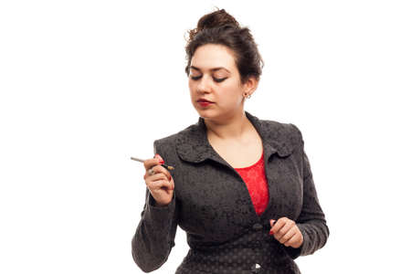 Confident business woman portrait with pen isolated over a white の写真素材