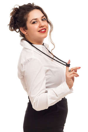 confident woman playing with necklace on white の写真素材