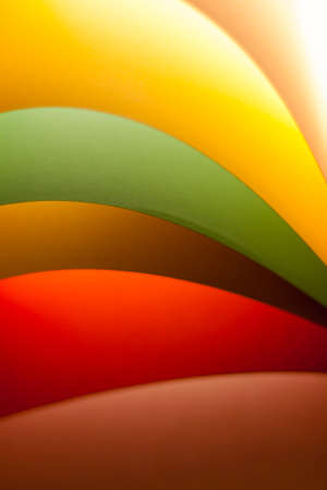 Colorful paper in unique shapes with shadow effect and selective focus.の写真素材