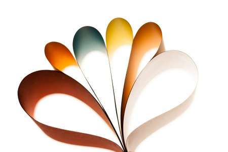 Colorful paper in unique shapes with shadow effect and selective focus.の写真素材