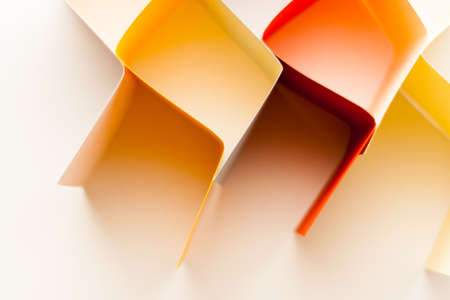 Colorful paper in unique shapes with shadow effect and selective focus.の写真素材