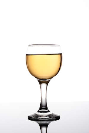 Classy colrfull backlit  glass with yellow drink and reflectionの写真素材