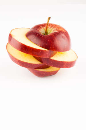 creativeli sliced red apple on white appleの写真素材