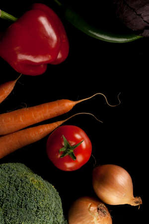 different vegetables shoot from above on black backgroundの写真素材
