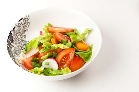 vegetable salad in a stylish black and white dishの写真素材