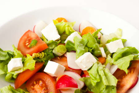 vegetable salad close up in a white bowlの写真素材