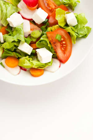vegetable salad close up in a white bowlの写真素材