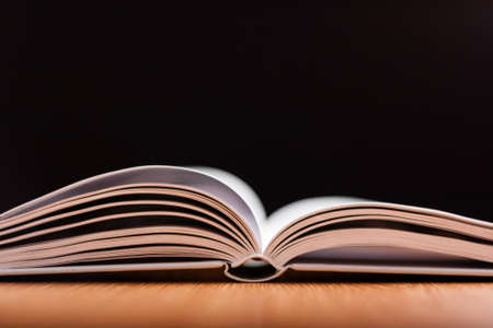 open book with white pages on wooden tableの写真素材