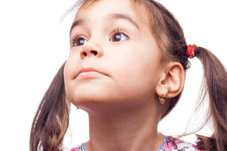 young girl on white background posing for the cameraの写真素材