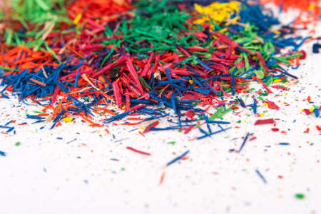 pencil shavings of different colors on whiteの写真素材