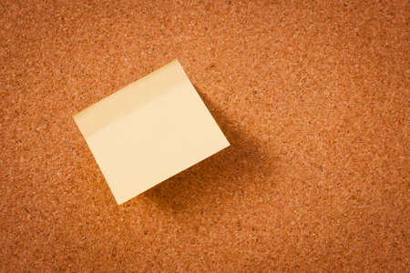 image of color blank post-it reminder on corkboardの写真素材