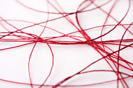 red color sewing strings as abstract backgroundの写真素材