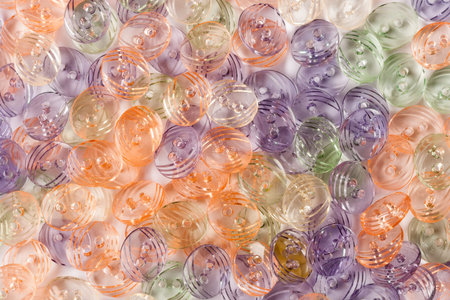 pile of bright color fashion buttons as background
