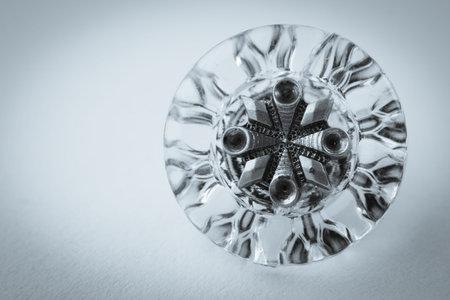 close up of a hand made vintage glass and steel button