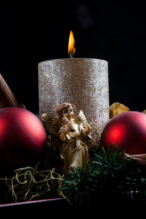 color christmas decoration ornament with golden candleの写真素材
