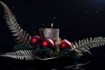 color christmas decoration ornament with golden candleの写真素材