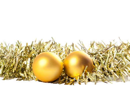 golden color festive christmas decoration with balls on white background