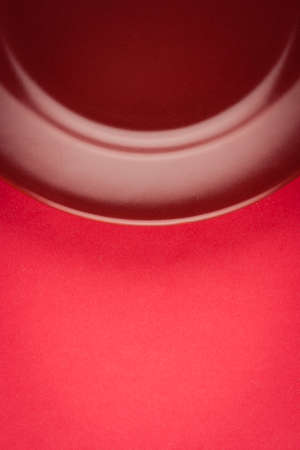 marsala color plate detail on red backgroundの写真素材