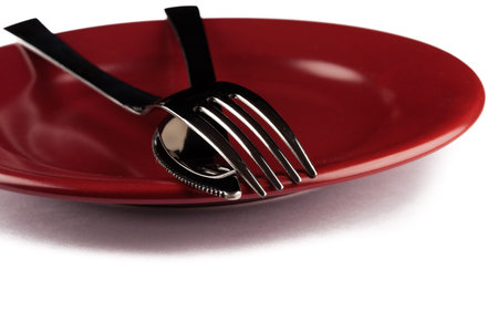 knife and fork close up on a plateの写真素材