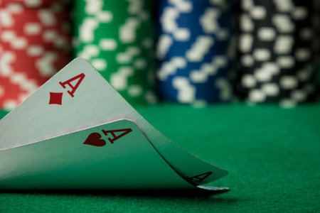two poker cards, aces, with poker chips in the backgroundの写真素材