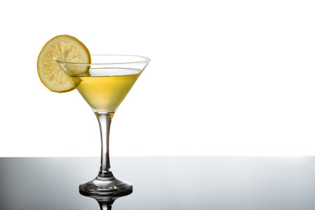 lemon martini on reflective table with lemon sliceの写真素材