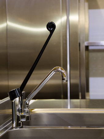 stainless steel home kitchen water tap and sinkの写真素材