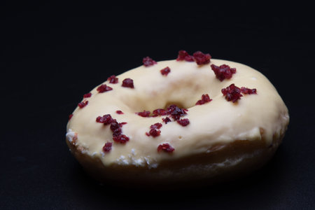doughnut with color cherry on black table
