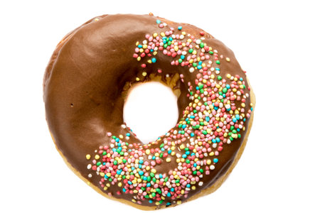 fresh sweet baked color doughnut dessert on white table