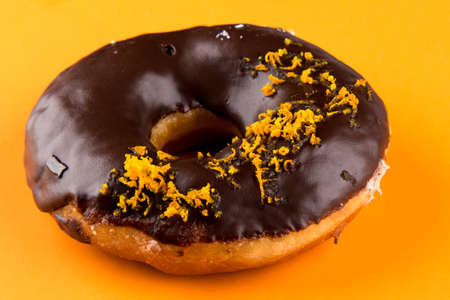 doughnut with orange on orange tableの写真素材