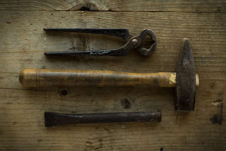 old vintage retro used tools on wooden tableの写真素材