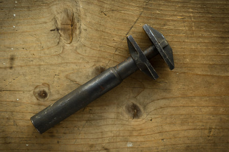 old vintage retro used adjustable wrench on wooden table