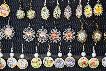 assortment of vintage color hand made earringsの写真素材