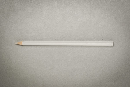white color drawing pencil on gray paperの写真素材