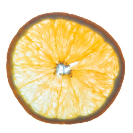 back lit fresh organic orange slice on whiteの写真素材