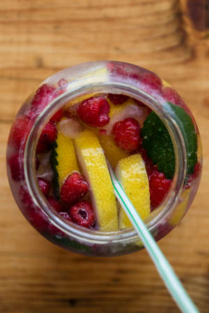 refreshing cold raspberry cocktail in glass jarの写真素材