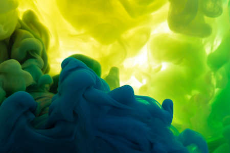 Abstract acrylic paint color swirls in water, background.の写真素材