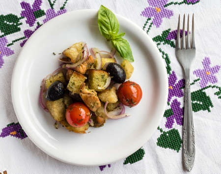 fresh italian panzanella appetizer with tomatoes, bread and chickenの写真素材