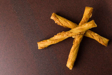 fresh pastry sticks with cheese on tableの写真素材
