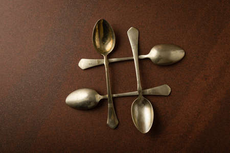 retro vintage used old spoons on a tableの写真素材