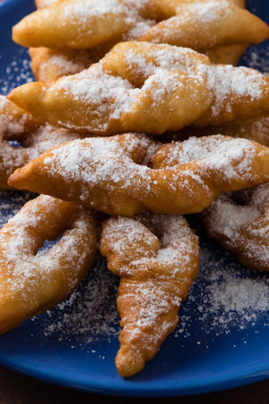 fresh crispy deep fried hungarian traditional pastry on blue palte