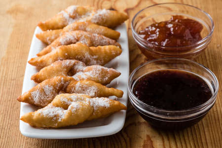 fresh crispy deep fried hungarian traditional pastry with jamの写真素材