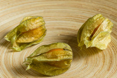 fresh natural exotic physalis berries on a plateの写真素材