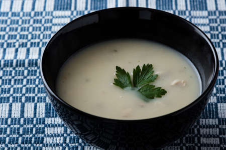 fresh healthy champignon soup in black bowlの写真素材