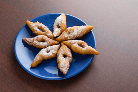 fresh crispy deep fried hungarian traditional pastry on blue palteの写真素材
