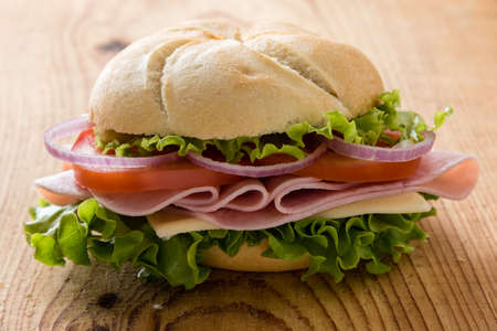 fresh tasty ham sandwich on wooden tableの写真素材