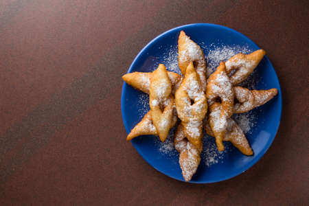 fresh crispy deep fried hungarian traditional pastry on blue palteの写真素材