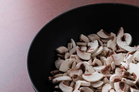 fresh healthy white chopped champignons in a panの写真素材