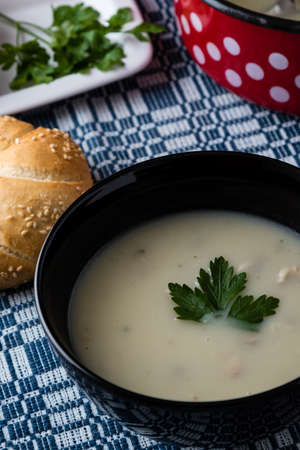 fresh healthy champignon soup in black bowlの写真素材